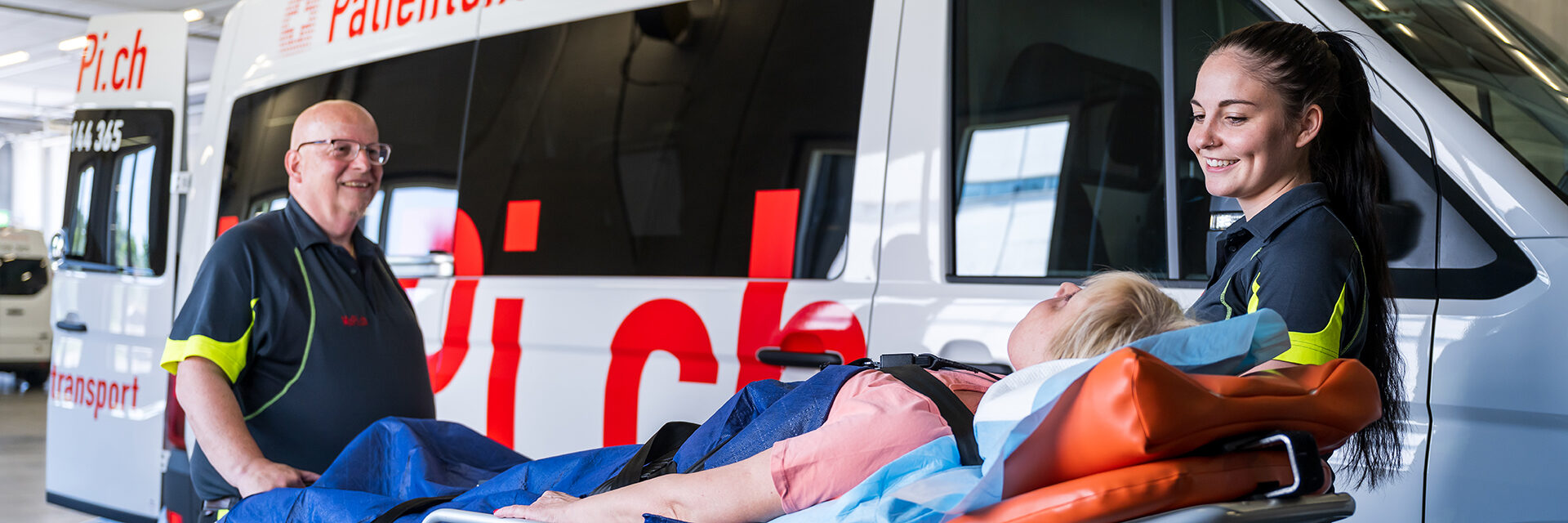 A MoPi.ch patient transport vehicle on duty outside a hospital