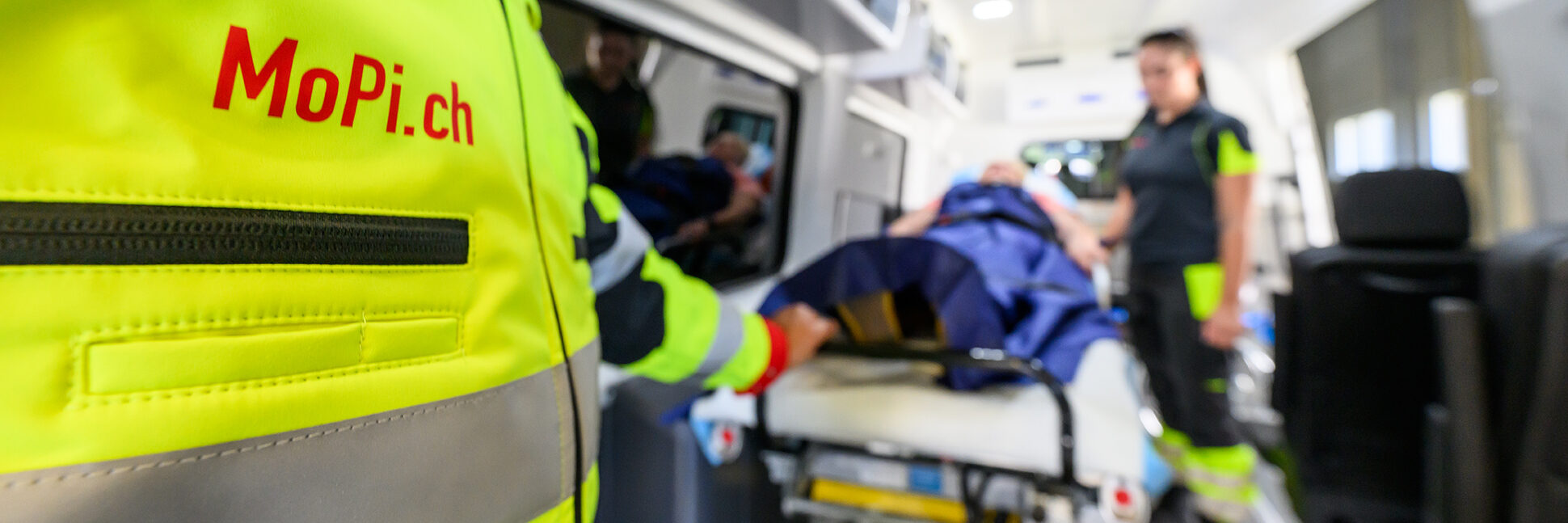 A nurse caring for a patient during the journey inside the vehicle